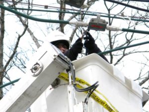 Comcast employee works on lines