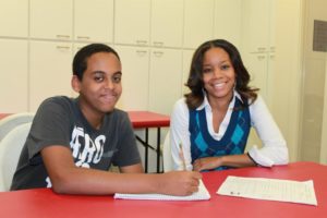 An AHC volunteer tutor with her student