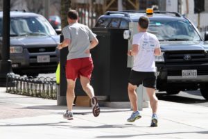 Men running in Clarendon