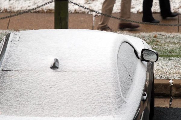 A dusting of snow covers a car in Pentagon City