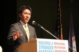 Walter Tejada, speaking at a panel discussion on immigration at Kenmore Middle School