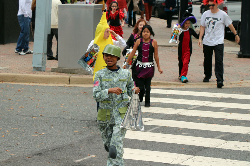 Elementary schoolers trick-or-treat in Courthouse