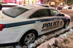 Arlington police car parked in the snow (file photo)