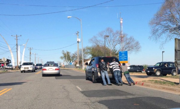 A Buick gets pushed down Columbia Pike