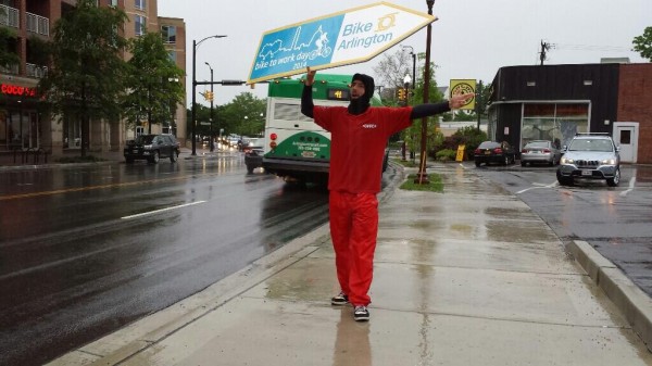 Sign spinner on Bike to Work Day (photo via @BikeArlington)