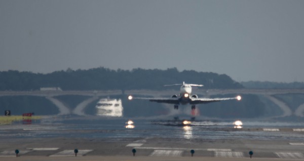 Plane above the runway at DCA, Reagan National Airport (Flickr pool photo by John Sonderman)