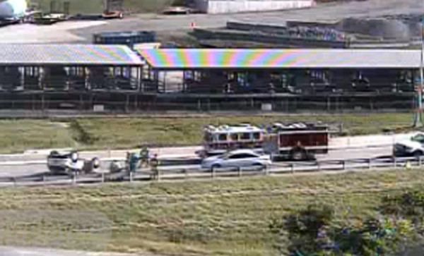 Accident involving an overturned vehicle on the SB I-395 ramp to Washington Blvd