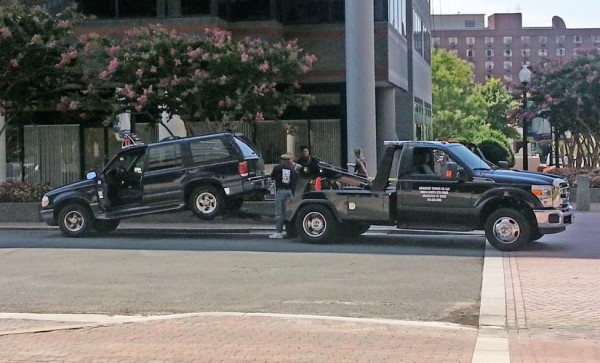 A Jimmy John's delivery vehicle is towed