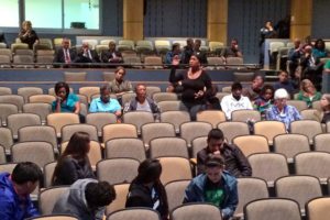 Speakers at a police forum at Wakefield High School