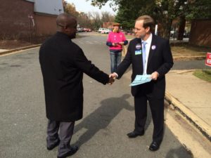 Alan Howze talks to a voter outside the Wilson School in Rosslyn 11/4/14