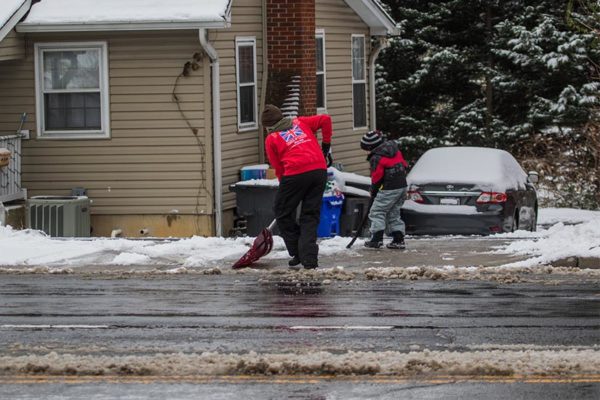 Mother and son shovel snow on 1/6/14 (Flickr pool photo by Erinn Shirley)