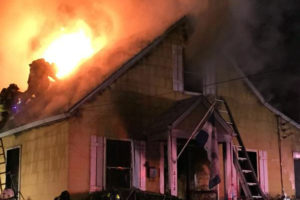 Firefighters work to put out a house fire on the 2100 block of S. Randolph Street (photo via @IAFF2800)