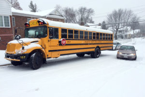 Car hits a stuck school bus at S. Joyce and 23rd Street. No children were on board.