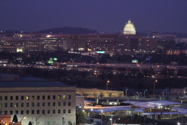 Capitol dome at night with the Pentagon in the foreground