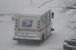 US Postal Service mail truck in the snow 2/21/15