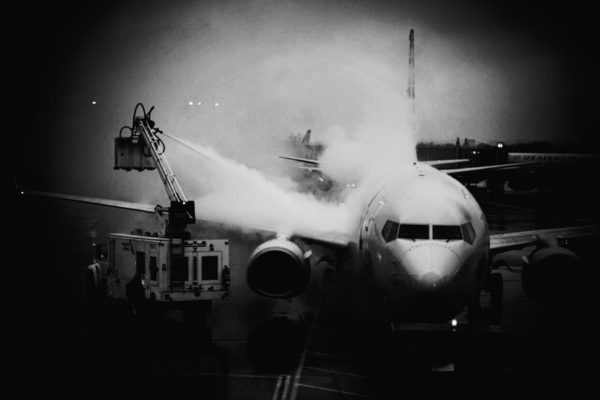 De-icing a plane at Reagan National Airport (Flickr pool photo by Kevin Wolf)