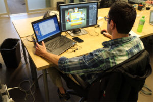 Entrepreneur at work on a computer in UberOffices in Rosslyn