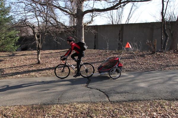 Bicyclist on the Custis Trail with child