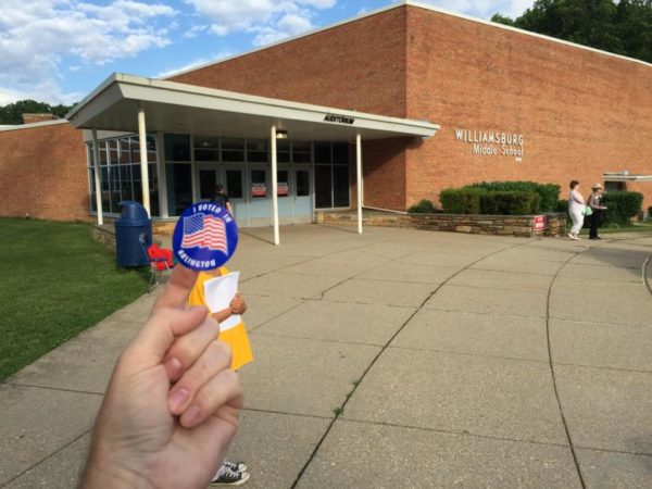 I Voted sticker outside a polling station (Flickr pool photo by Kevin Wolf)