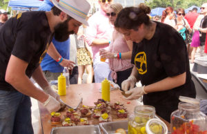 2014 BRGR Bash competitors assemble burgers. (Courtesy of Darren Stauffer)