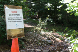 Signs line the Donaldson Run trail.