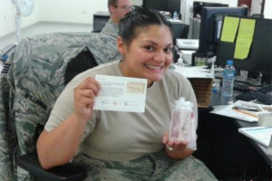 Female service member with spa goods