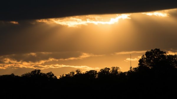 Sun rays peeking through clouds on the Potomac (Flickr pool photo by John Sonderman)