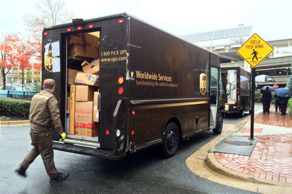 UPS trucks overloaded with packages, at the Pentagon Row shopping center