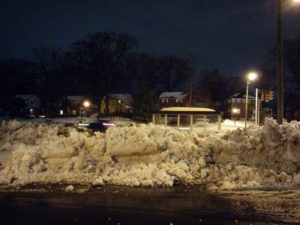 Snow piled in front of a bus stop (photo courtesy Alex Chamandy)