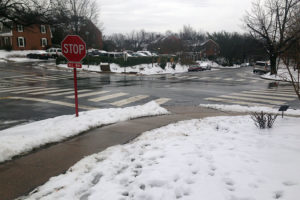 Snow, ice and rain on a road and sidewalk in Fairlington