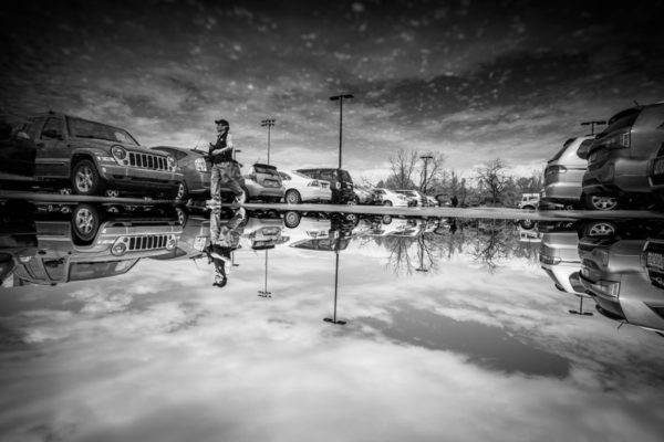 Parking lot puddle (Flickr pool photo by Kevin Wolf)