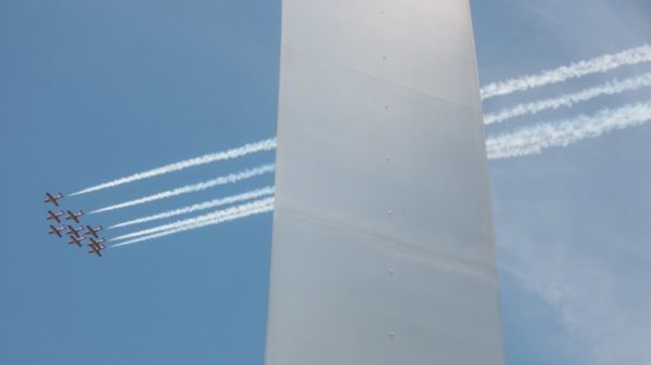 Canadian Forces Snowbirds fly over D.C., with the Air Force Memorial in the foreground