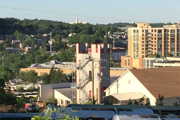 The Washington Monument is seen in the distance, above Arlington County's fire training facility near Shirlington