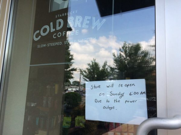 Sign on the door of the Clarendon Starbucks, which is closed due to the Market Common Clarendon power outage