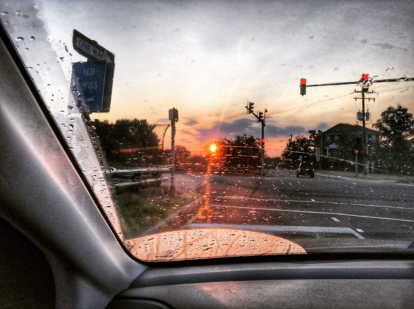 Post-rainstorm summertime sunrise while driving (Flickr pool photo by Dennis Dimick)