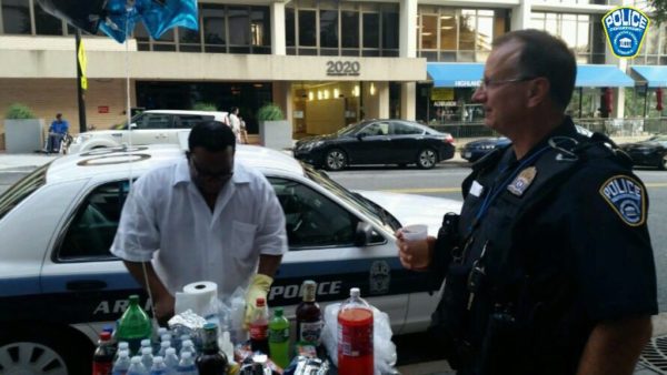 A man serves food and drinks for Arlington County police officers (photo courtesy ACPD)