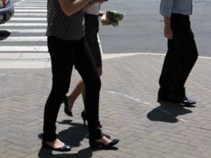 Young people walking on a sidewalk in Ballston