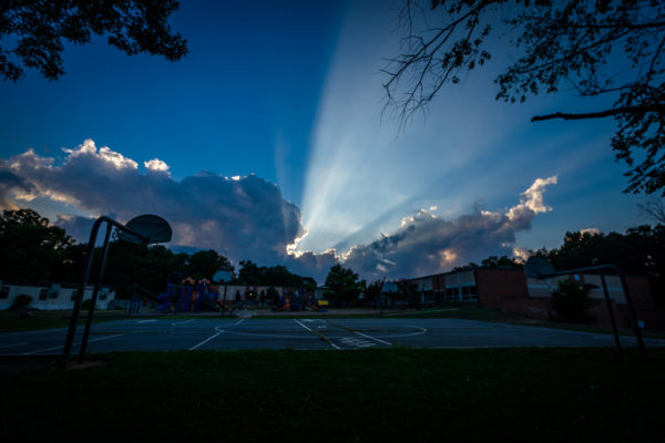 Clouds and rays of sunlight above Claremont Immersion School (Flickr pool photo by Erinn Shirley)