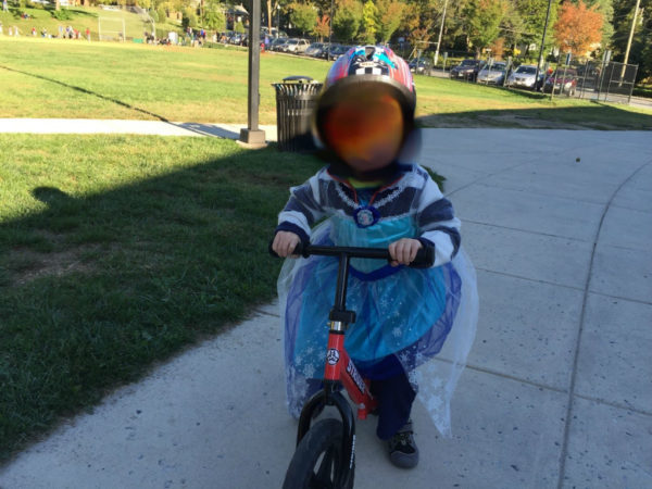 Crabb and Johnson's son wearing dress while cycling