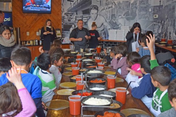 Bronx Pizza owner Mike Cordero teaches Arlington students how to make pizza (photo courtesy Alexis Fedoroff)