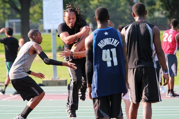 Playing basketball in Aurora Highlands park