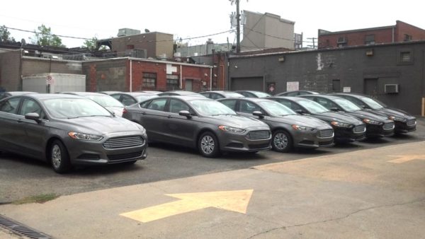 New Ford Fusion sedans awaiting conversion to Red Top taxicabs in Clarendon